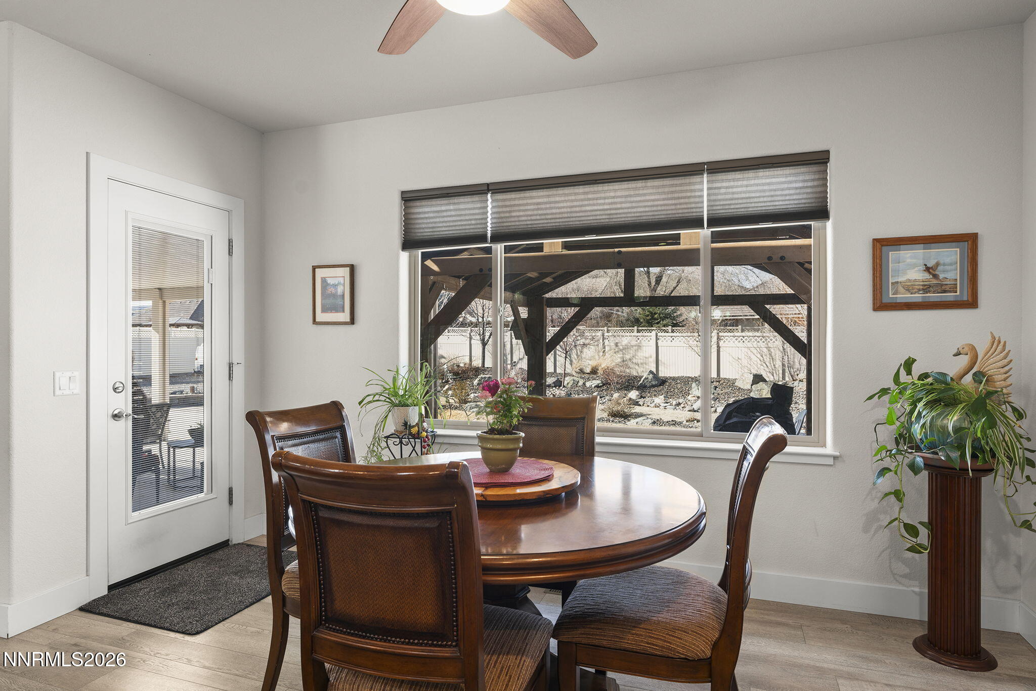 404 Chianti Way Dayton, NV 89403 - Photo 19 of 42 a view of a dining room with furniture and a potted plant