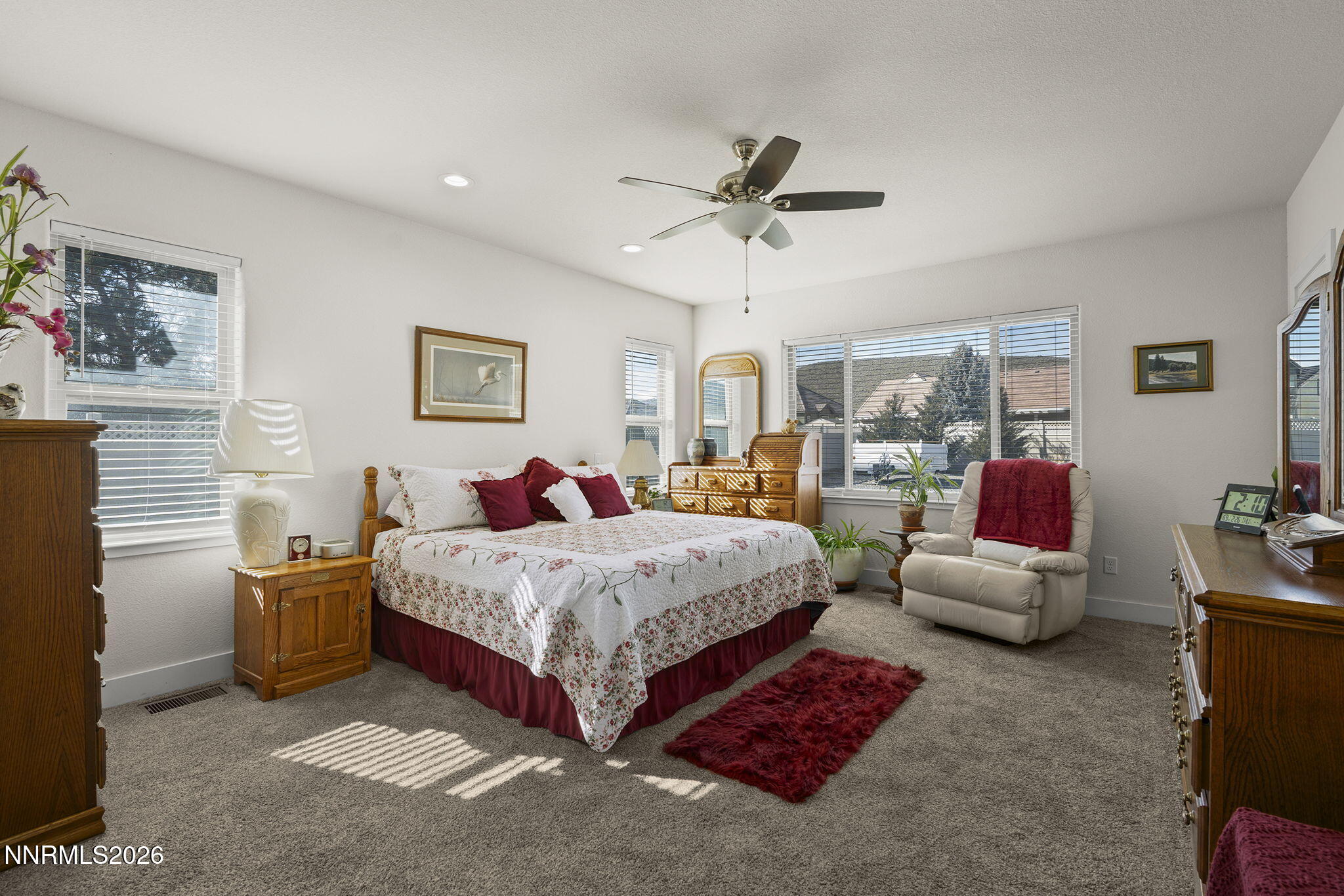 404 Chianti Way Dayton, NV 89403 - Photo 20 of 42 a spacious bedroom with a bed and ceiling fan