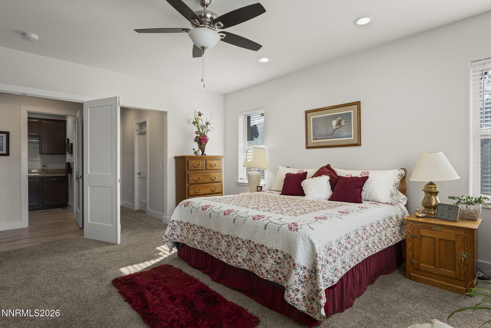 404 Chianti Way Dayton, NV 89403 - Photo 22 of 42 a bedroom with a bed and a chandelier