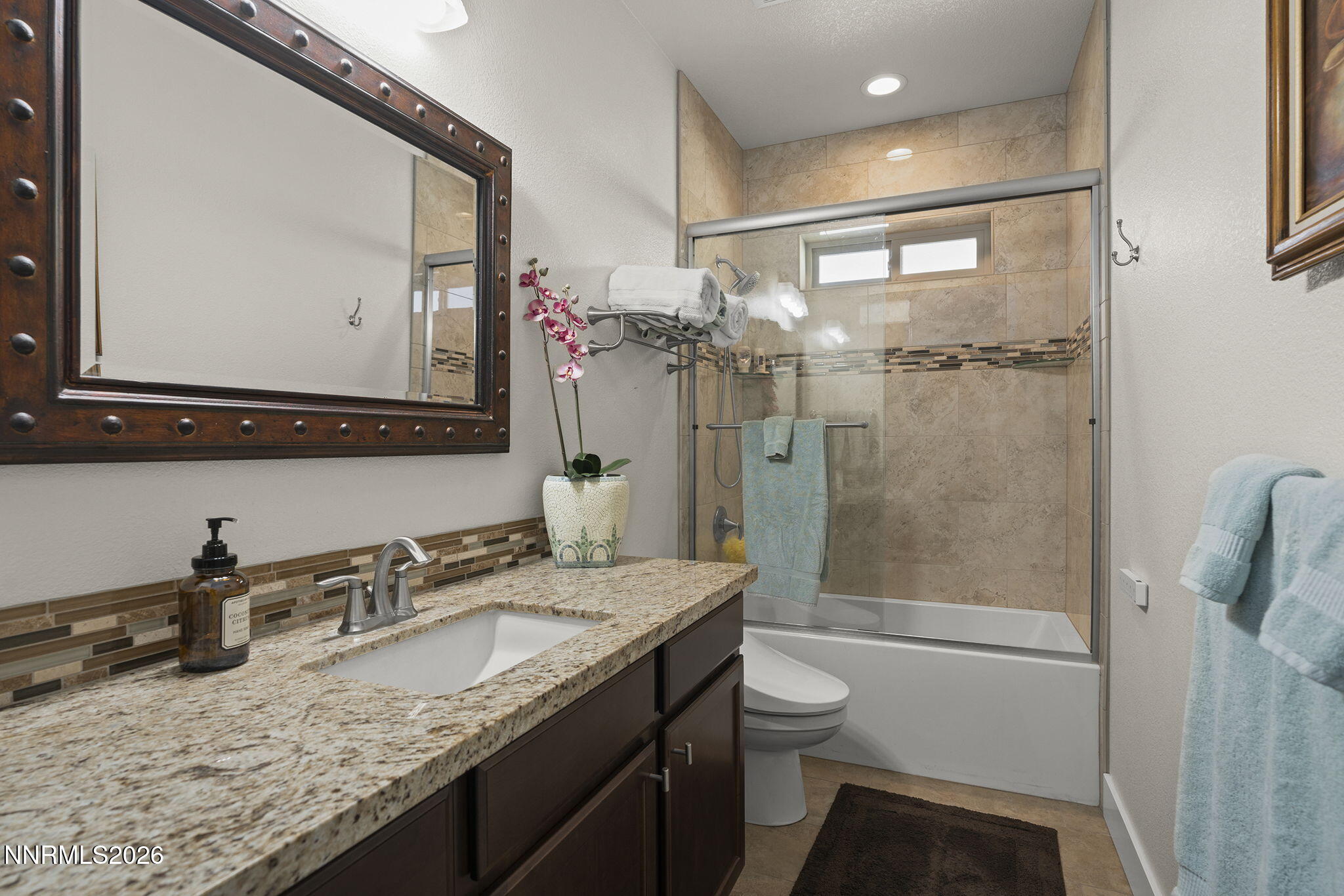 404 Chianti Way Dayton, NV 89403 - Photo 27 of 42 a bathroom with a granite countertop sink toilet and shower