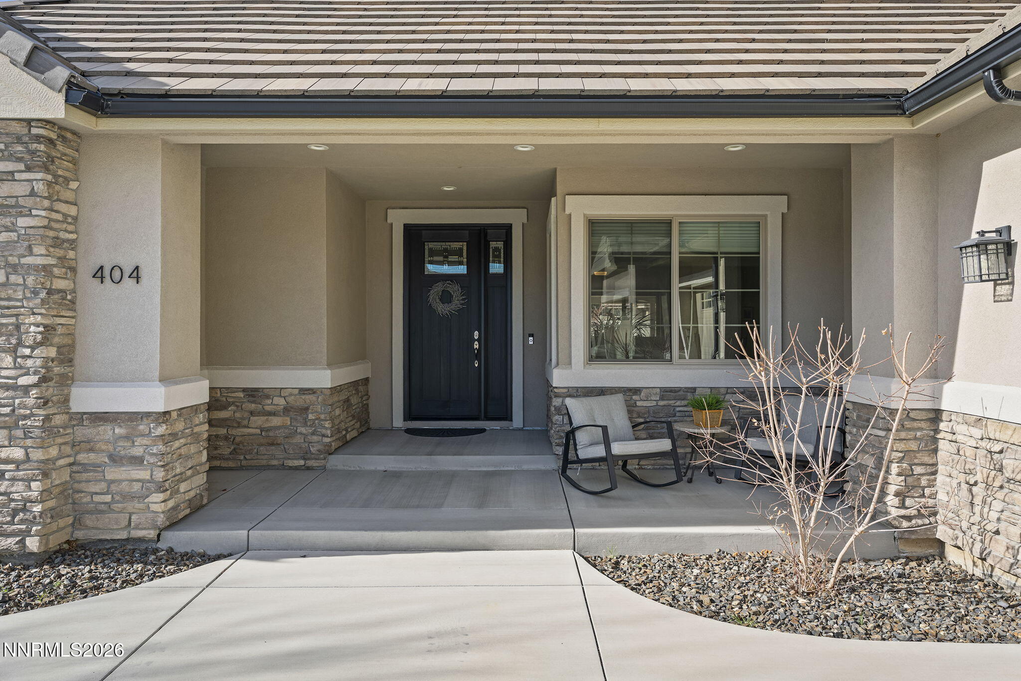 404 Chianti Way Dayton, NV 89403 - Photo 6 of 42 a front view of a house with outdoor seating