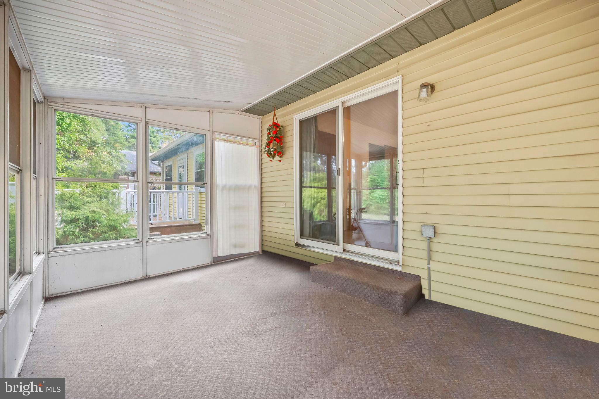 153B Sunset Road Whiting, NJ 08759 - Photo 15 of 19 a view of a room with large windows