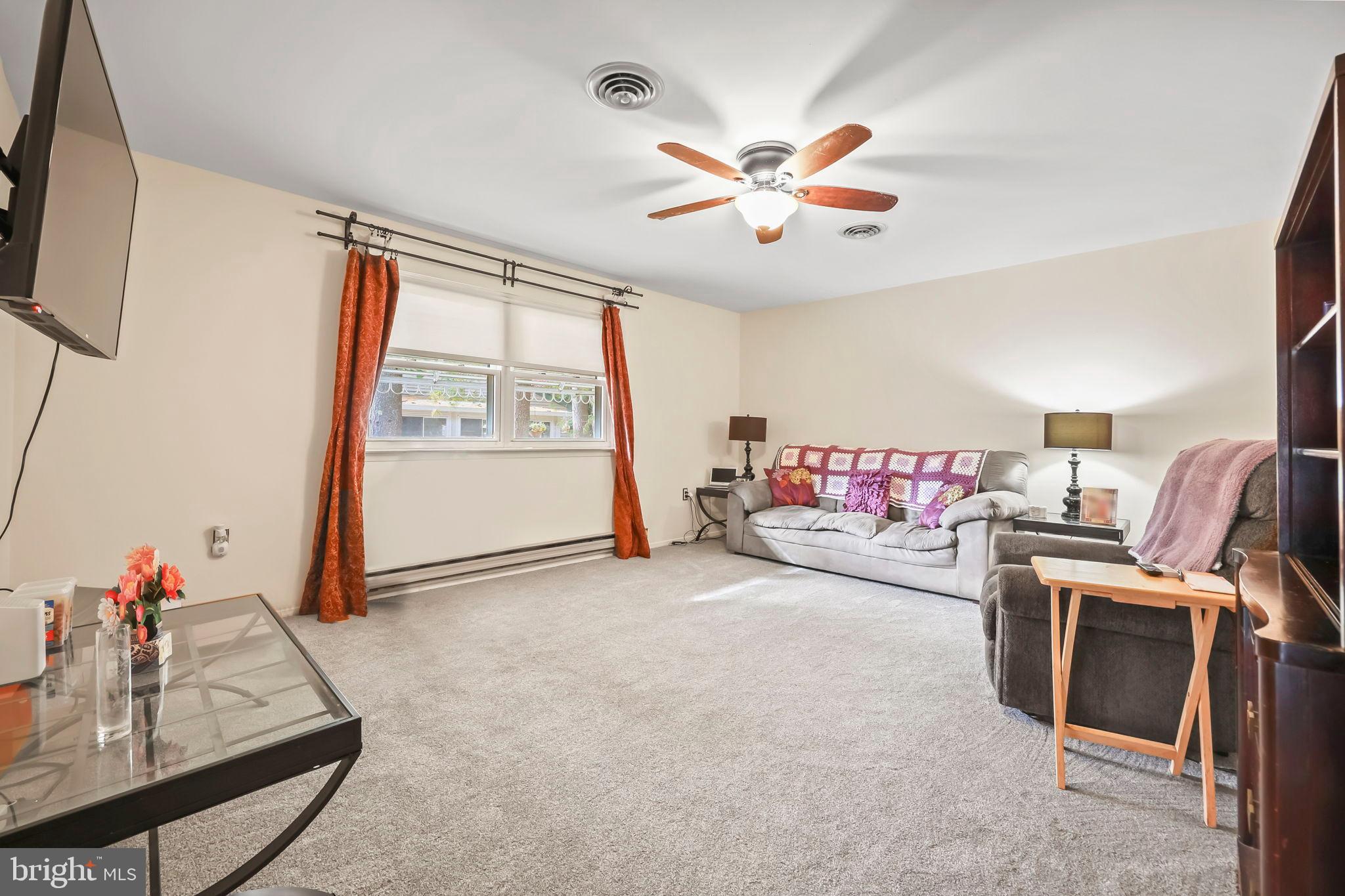 153B Sunset Road Whiting, NJ 08759 - Photo 4 of 19 a living room with furniture and a flat screen tv