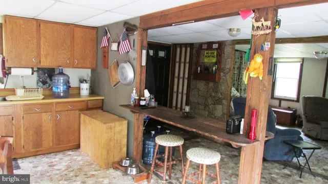 a kitchen with sink and cabinets