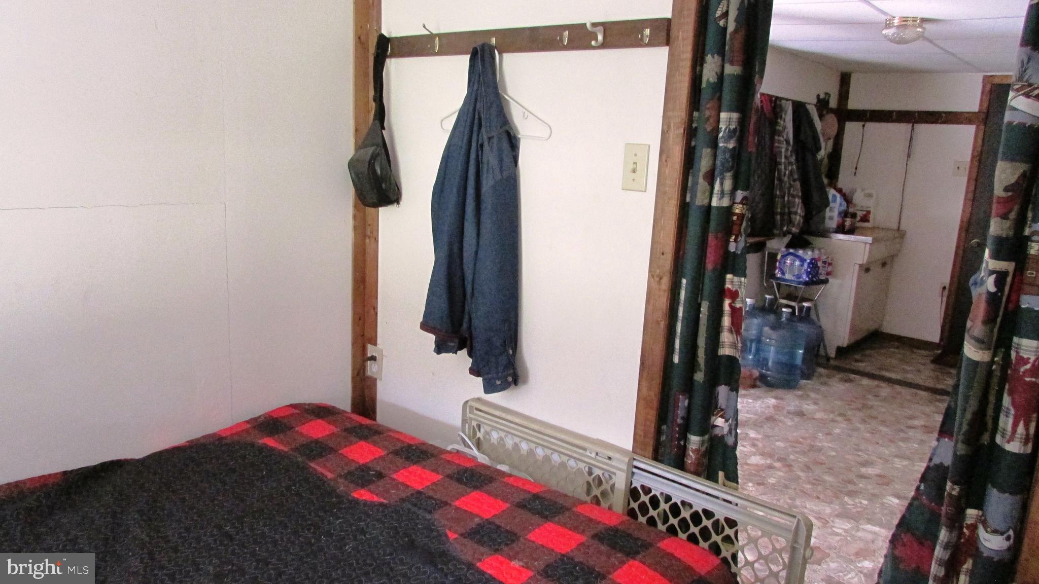 105 Big Run Road Howard, PA 16841 - Photo 18 of 37 a bedroom with a bed and a window