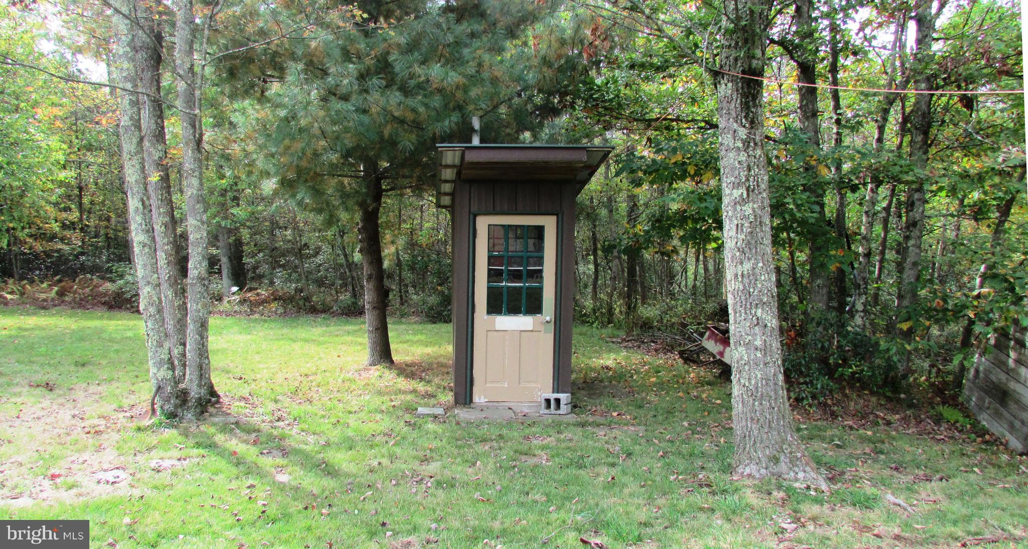 105 Big Run Road Howard, PA 16841 - Photo 22 of 37 a house with trees in front of it
