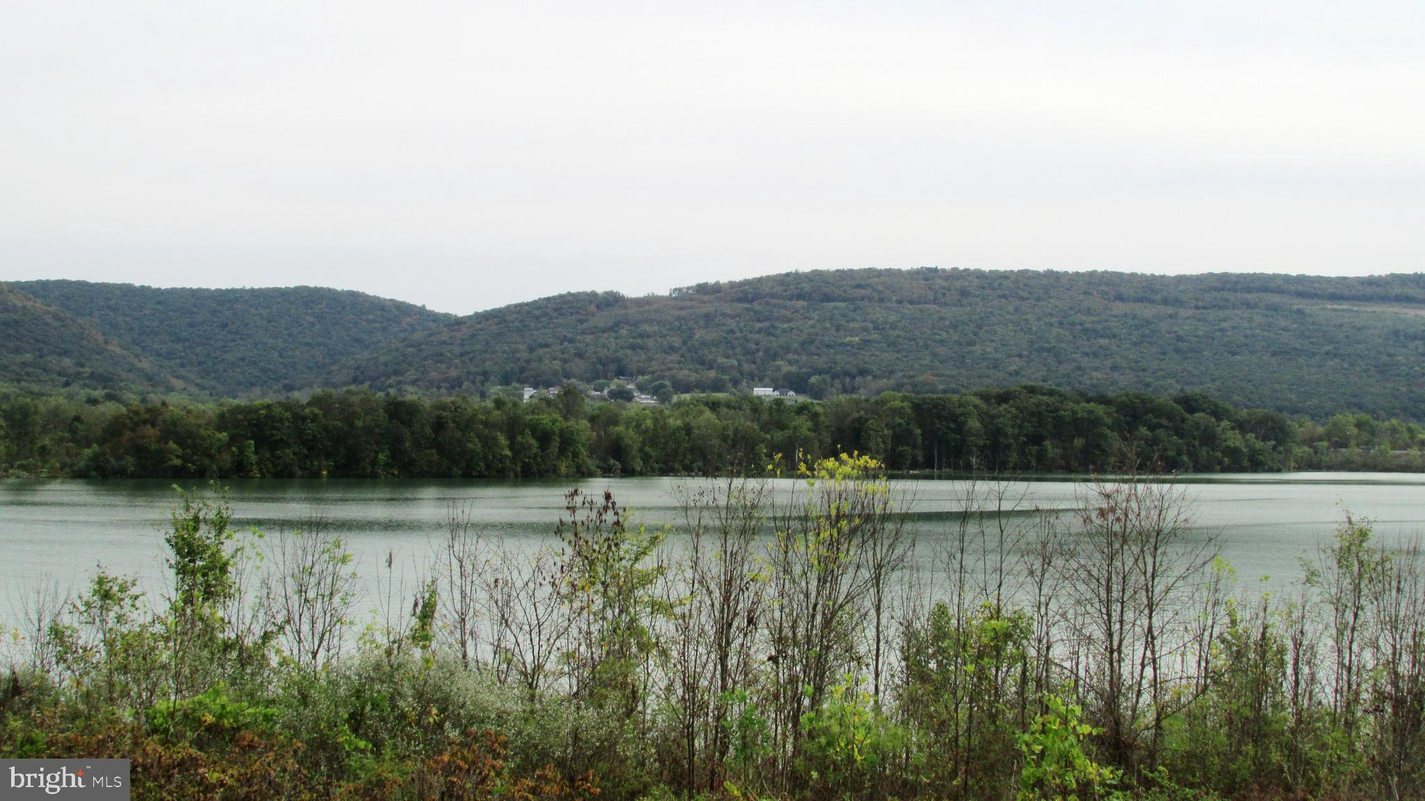 105 Big Run Road Howard, PA 16841 - Photo 34 of 37 a view of a lake with a mountain