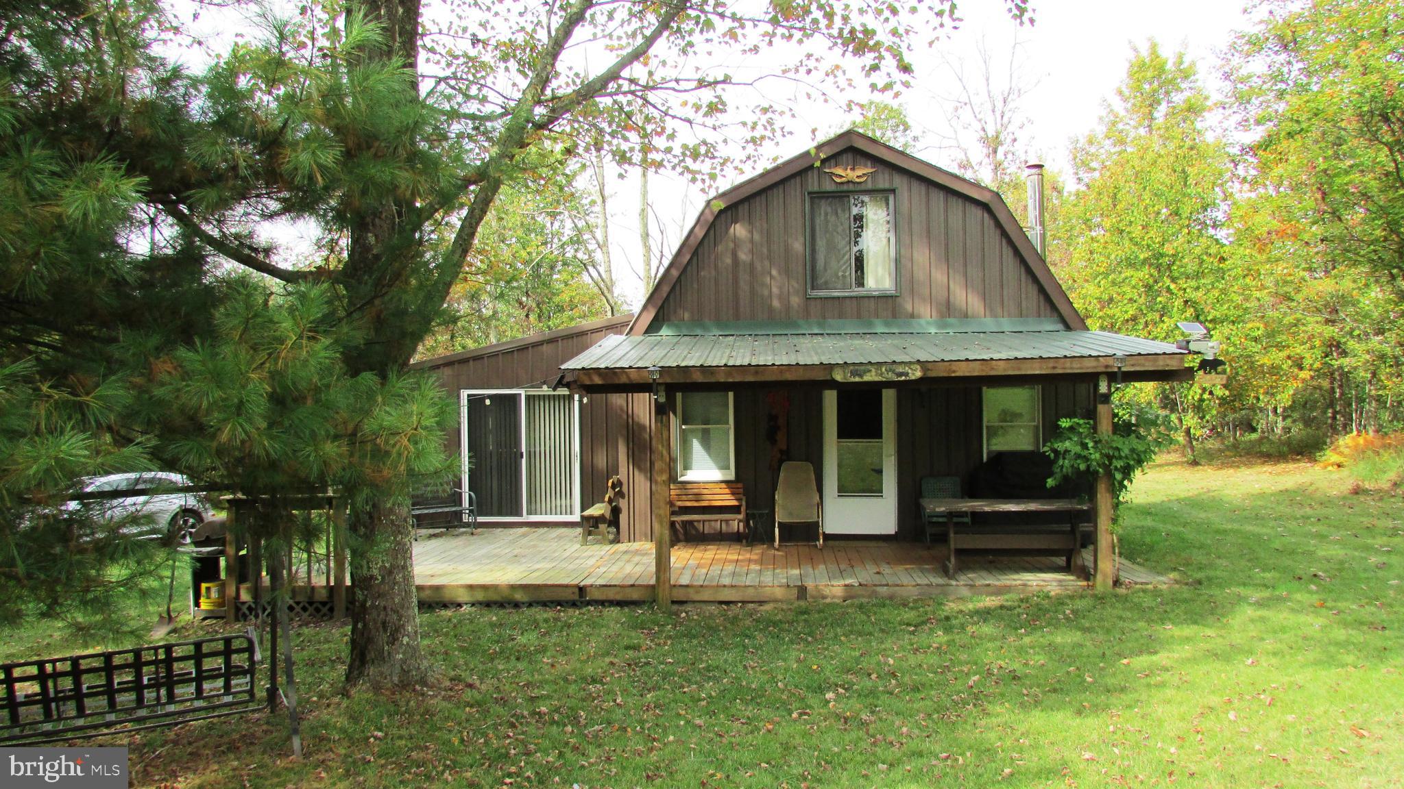 105 Big Run Road Howard, PA 16841 - Photo 37 of 37 a front view of a house with a garden