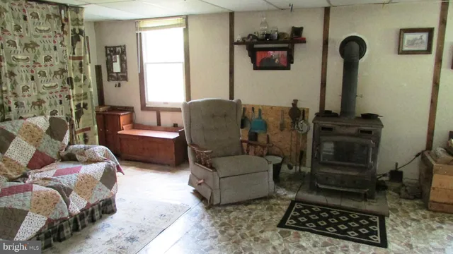 a living room with furniture rug and window