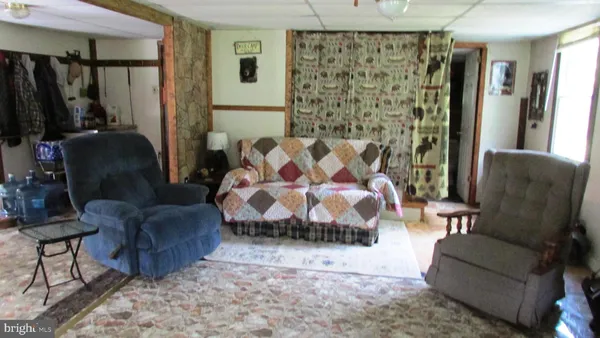 a living room with furniture and a bathtub