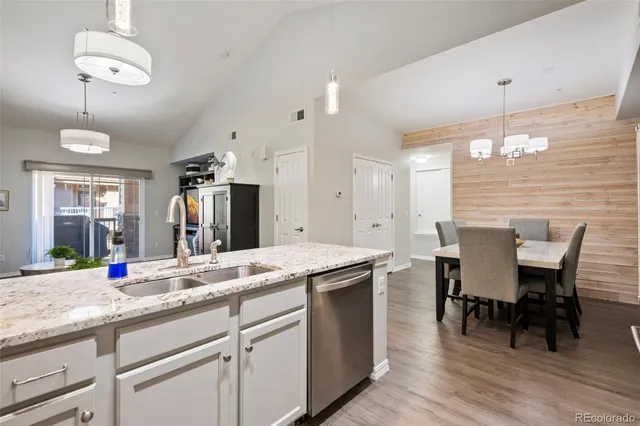 a kitchen with center island table and chairs in it