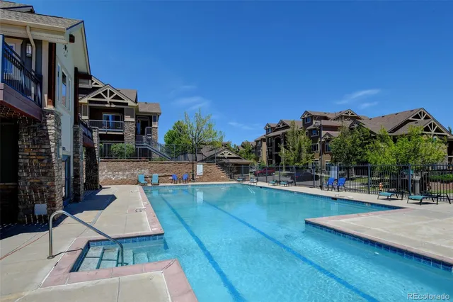 a view of a swimming pool with chairs