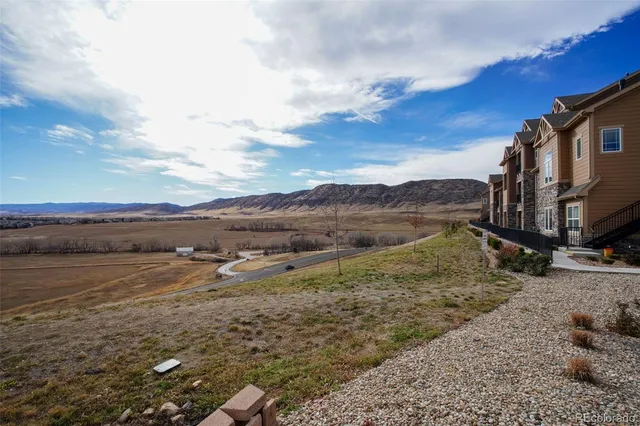 a view of an ocean beach and mountain