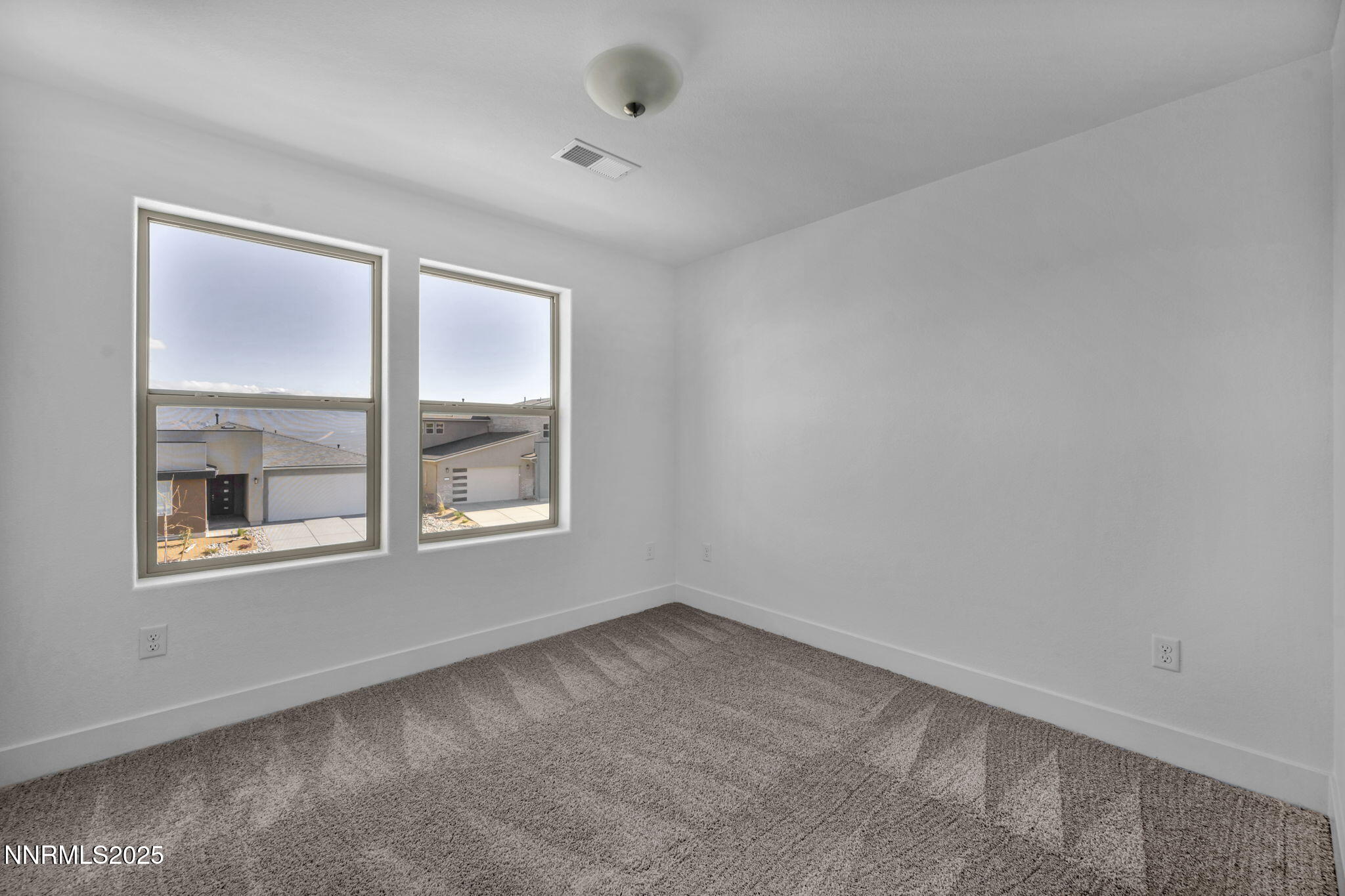 1310 Nebula Road, Unit HOMESITE 90 Carson City, NV 89705 - Photo 13 of 17 an empty room with a window