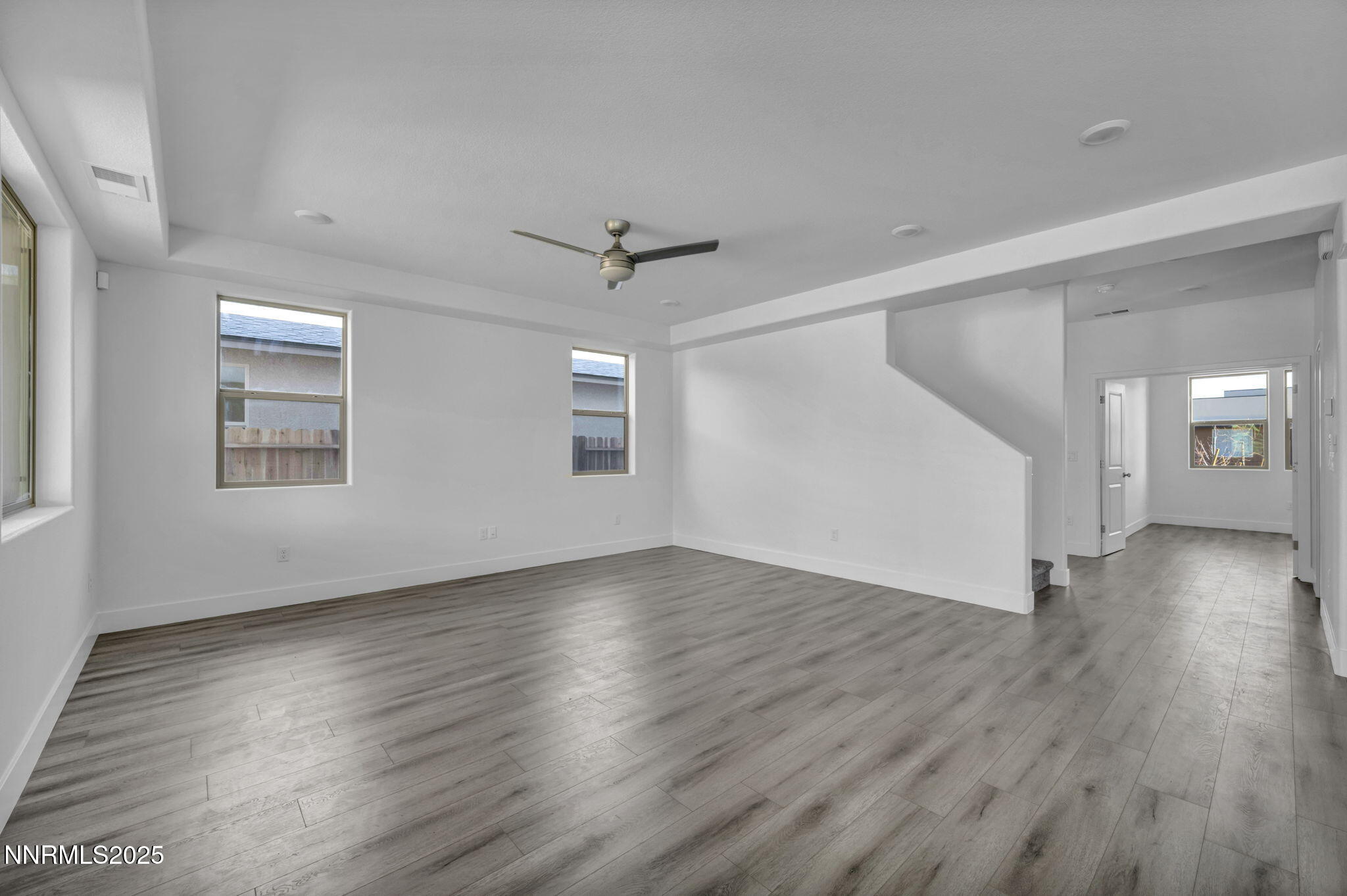 1310 Nebula Road, Unit HOMESITE 90 Carson City, NV 89705 - Photo 5 of 17 a view of an empty room with wooden floor and a window