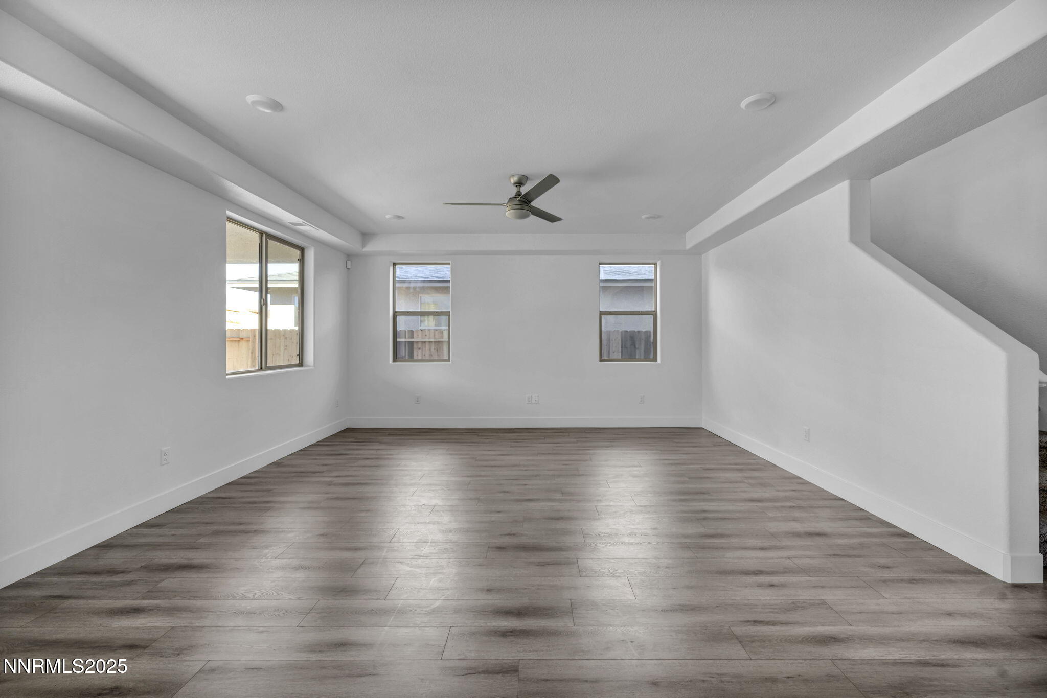 1310 Nebula Road, Unit HOMESITE 90 Carson City, NV 89705 - Photo 6 of 17 an empty room with wooden floor and windows