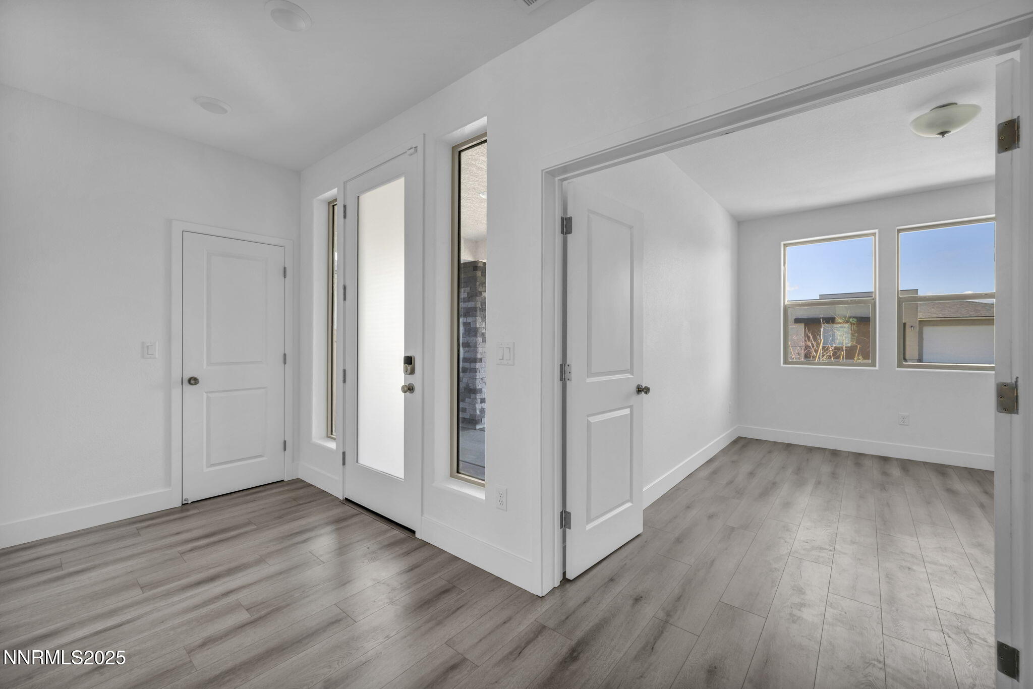 1310 Nebula Road, Unit HOMESITE 90 Carson City, NV 89705 - Photo 7 of 17 a view of an empty room with wooden floor and a window