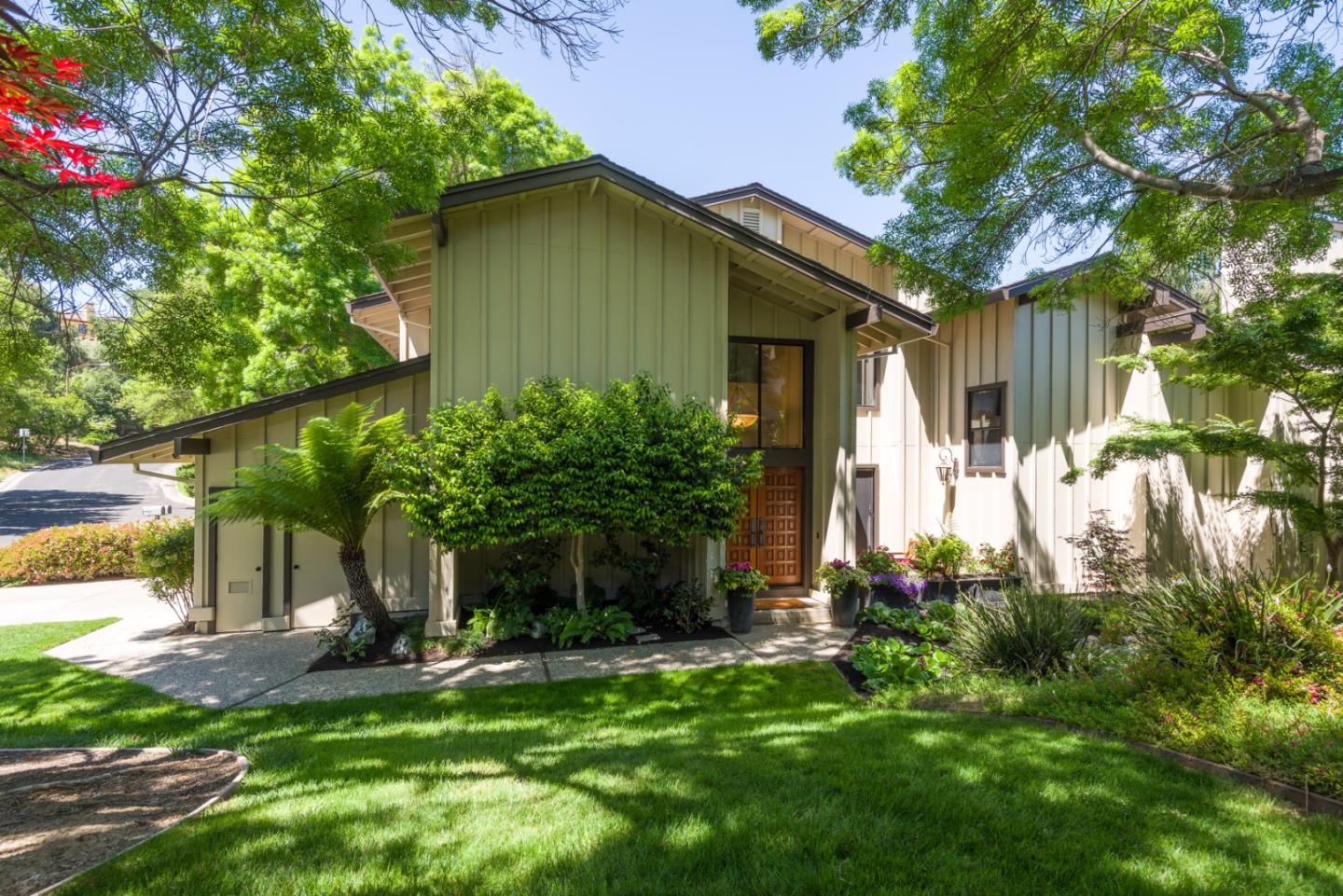 1265 Trinity Drive Menlo Park, CA 94025 - Photo 1 of 1 a front view of a house with a yard