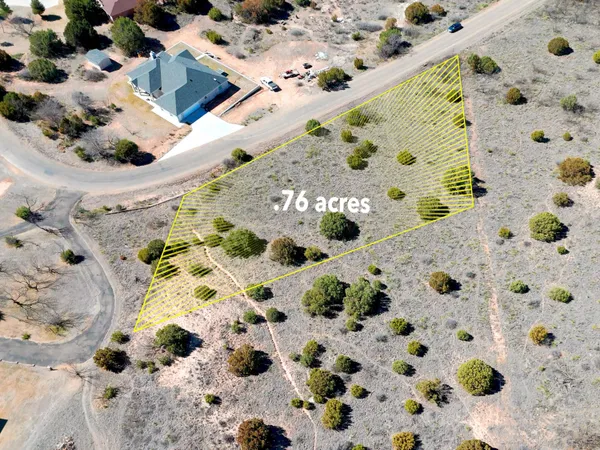 an aerial view of house with yard