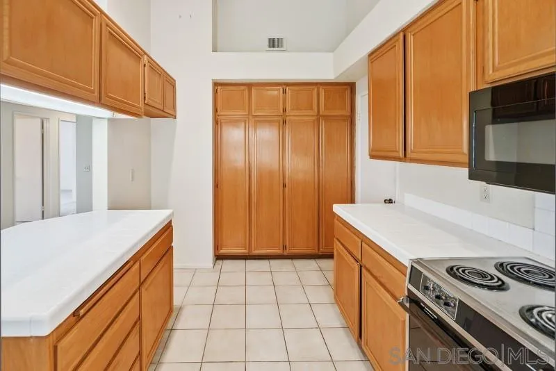 14047 Dogwood Road Poway, CA 92064 - Photo 10 of 32 a kitchen with a stove and a sink