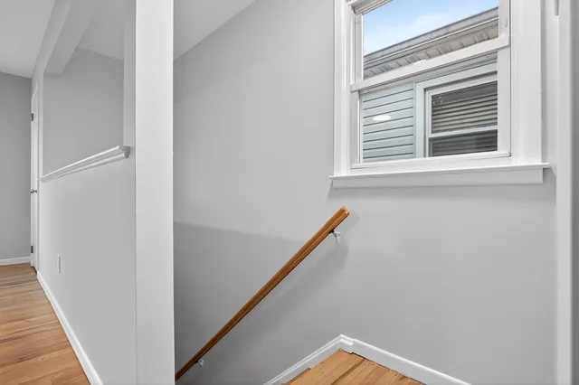 a view of a hallway with a window