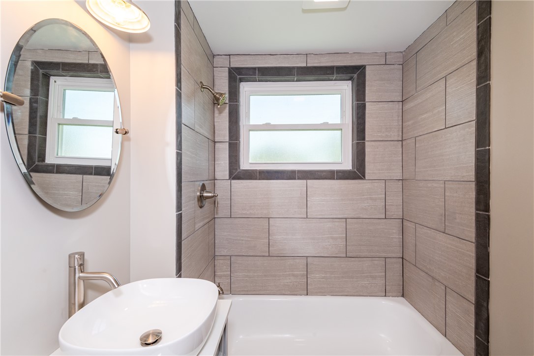 1217 Jasper Road Xenia, OH 45385 - Photo 44 of 62 This sleek bathroom features contemporary fixtures and modern tiling for a refreshing ambiance.