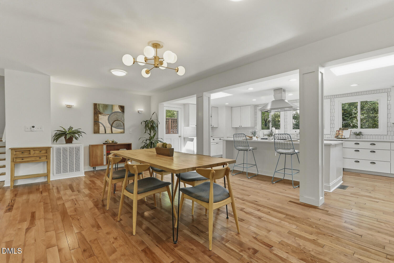 3704 Swann Street Raleigh, NC 27612 - Photo 7 of 21 a view of a dining room with furniture and wooden floor