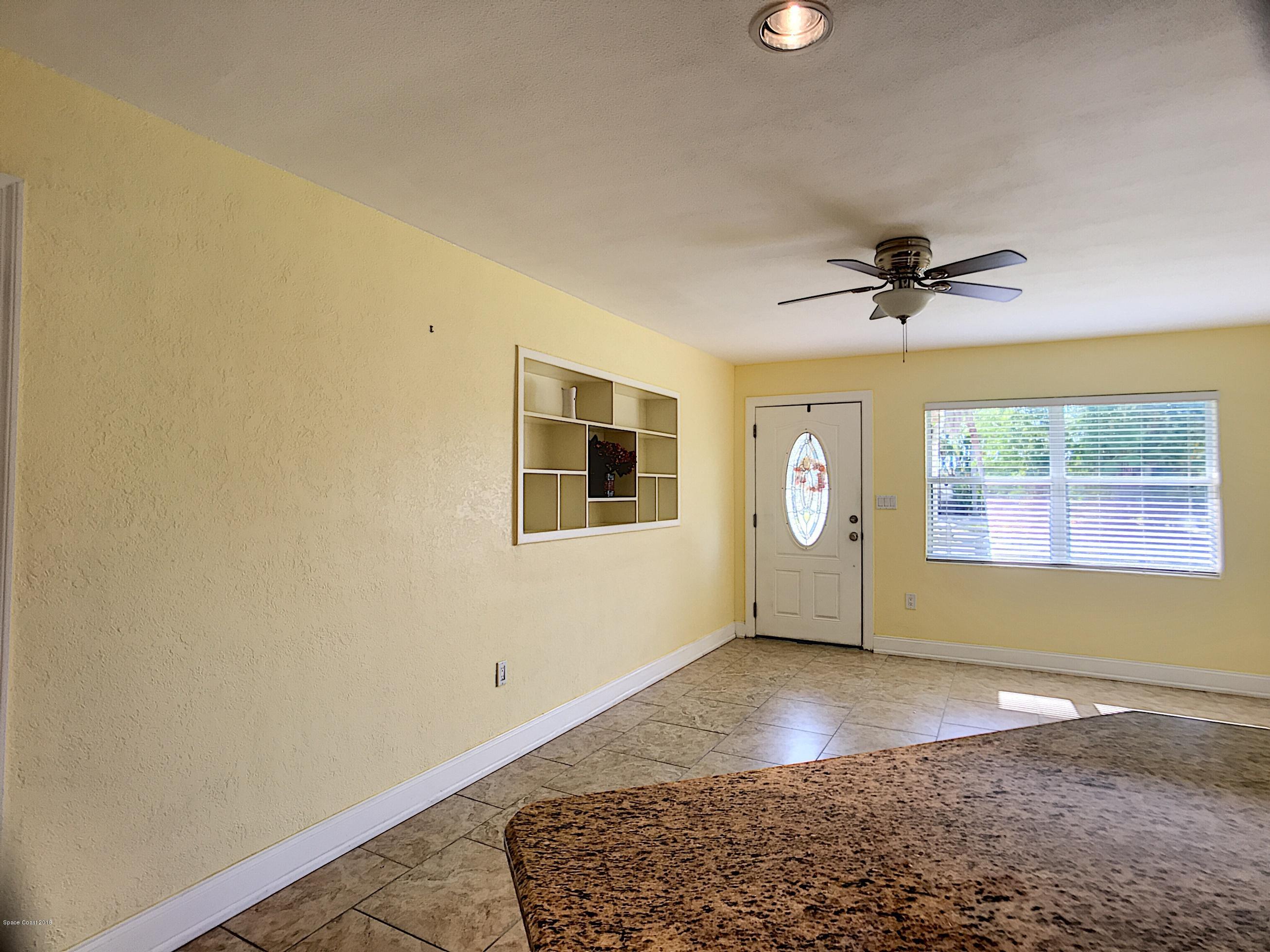 327 3rd Street Merritt Island, FL 32953 - Photo 13 of 26 a view of livingroom with window and ceiling fan