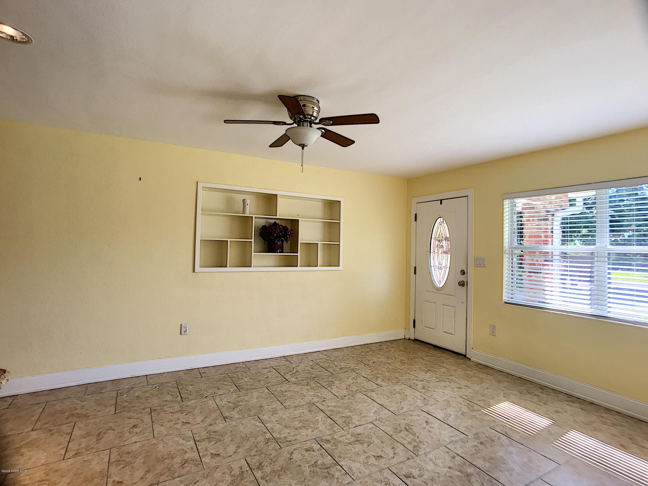 327 3rd Street Merritt Island, FL 32953 - Photo 14 of 26 a view of an empty room with a window