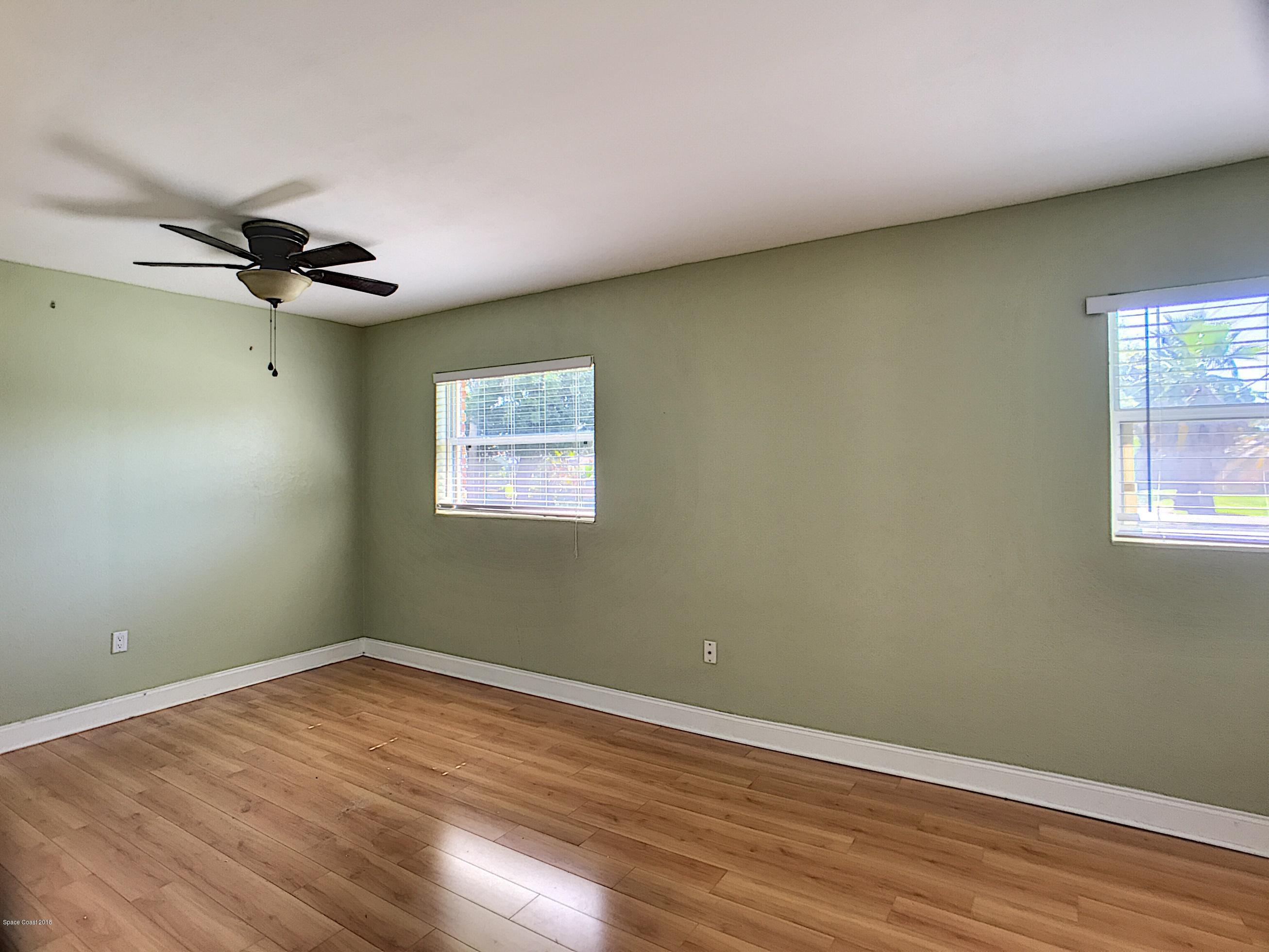 327 3rd Street Merritt Island, FL 32953 - Photo 20 of 26 a view of empty room with wooden floor