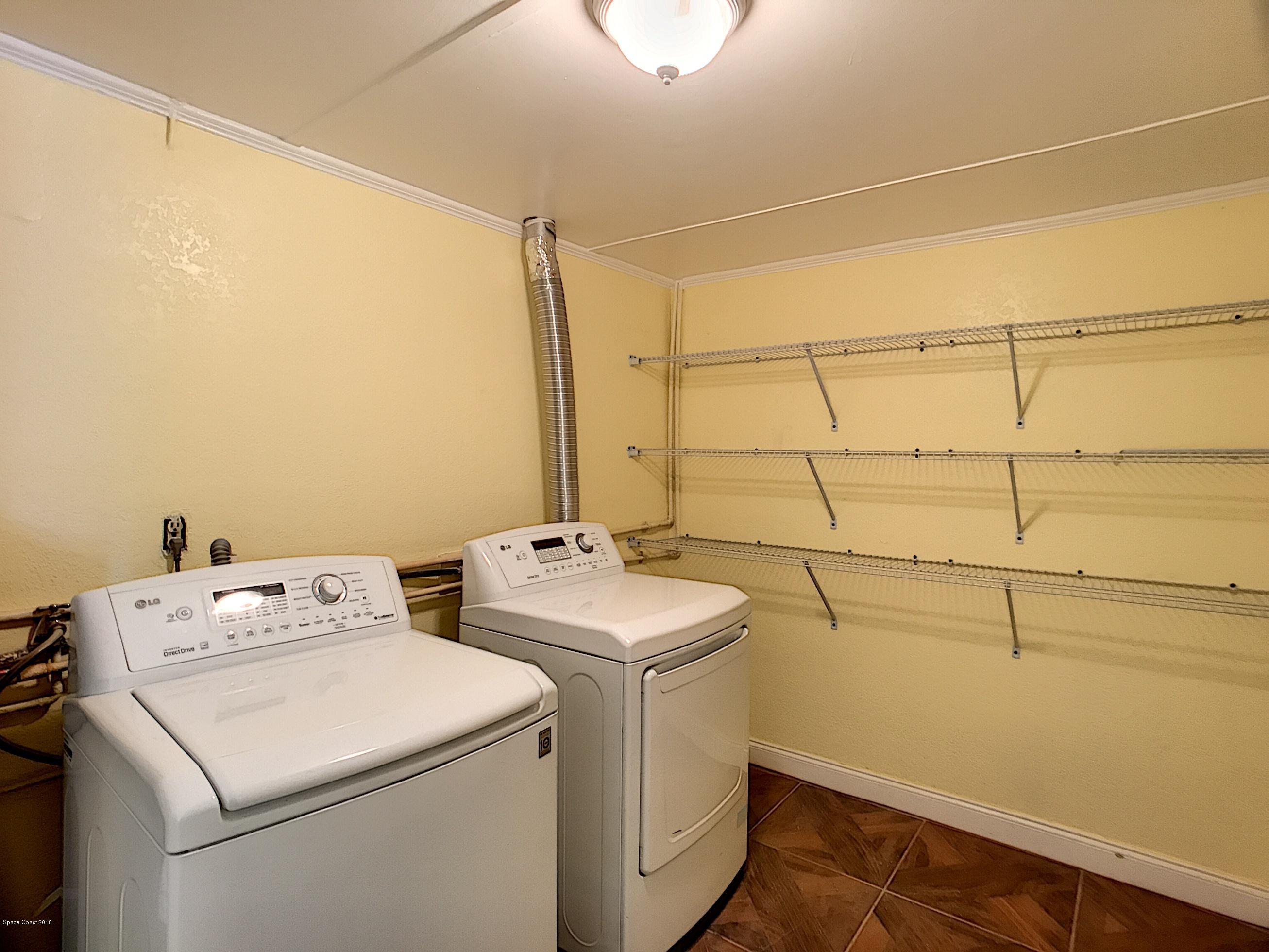327 3rd Street Merritt Island, FL 32953 - Photo 23 of 26 a utility room with dryer and washer