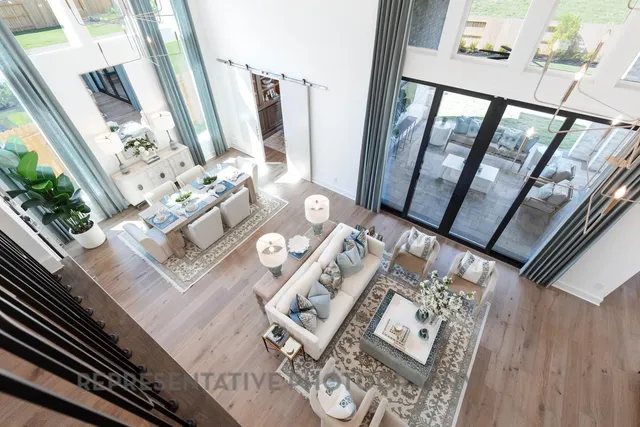 a view of living room with furniture and wooden floor