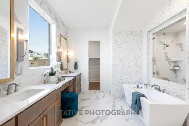 a bathroom with a sink double vanity and a bathtub