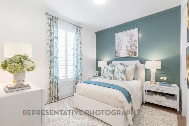 a bedroom with bed and a window