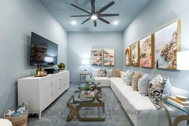 a living room with furniture and a flat screen tv