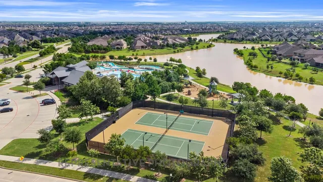 an aerial view of a house with a lake view