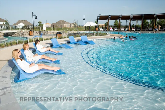 a view of swimming pool with outdoor seating