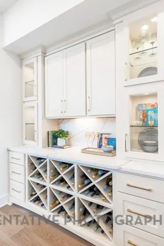 a view of a kitchen with furniture and wooden floor