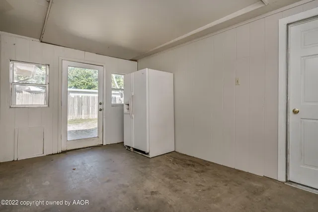 a view of a house with a yard and garage