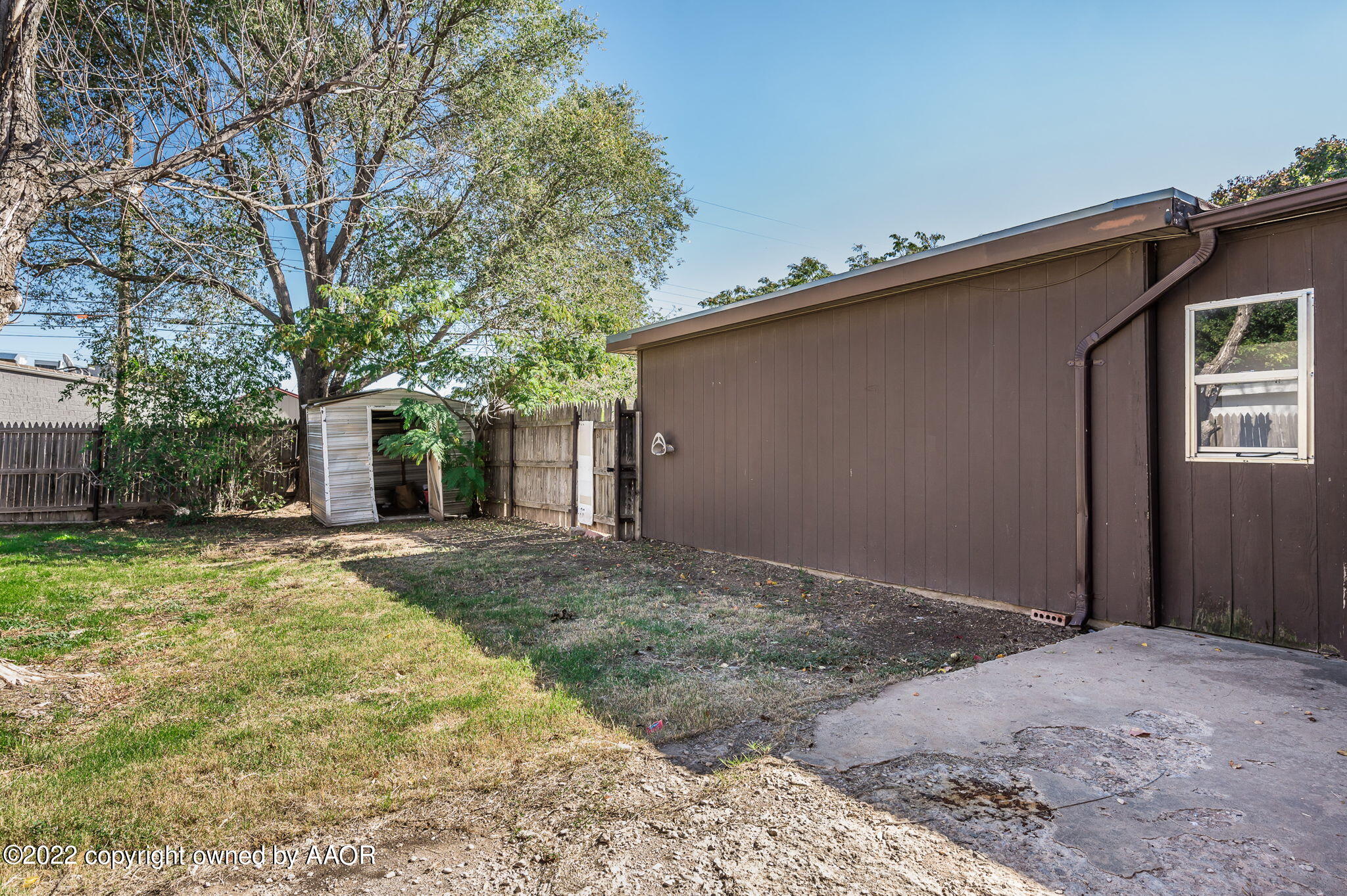 3405 Thurman Street Amarillo, TX 79109 - Photo 12 of 19 a view of a house with a yard and garage