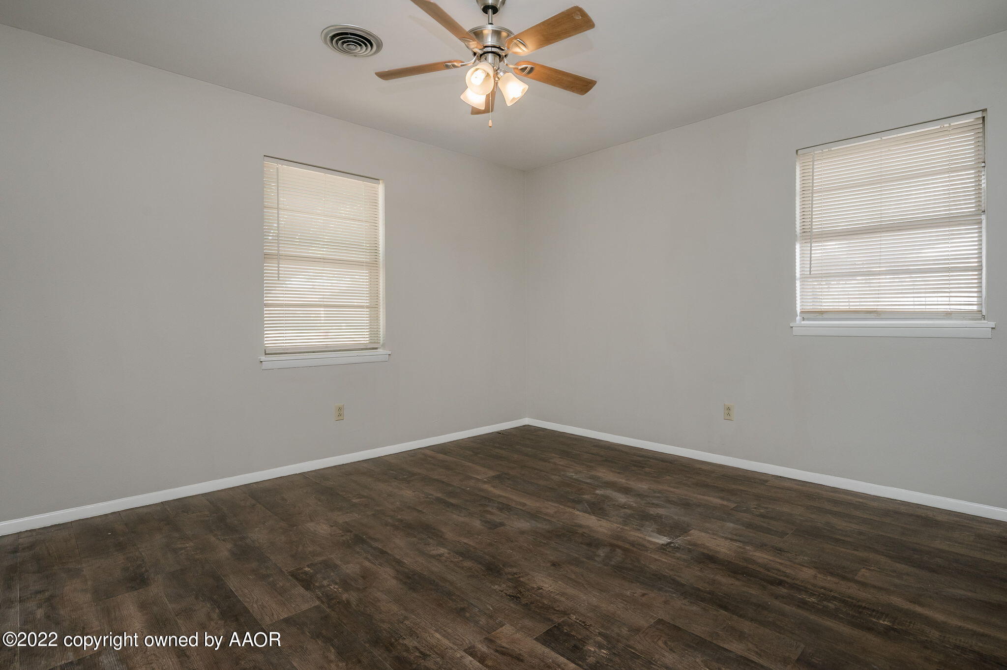 3405 Thurman Street Amarillo, TX 79109 - Photo 13 of 19 an empty room with a window and a fan