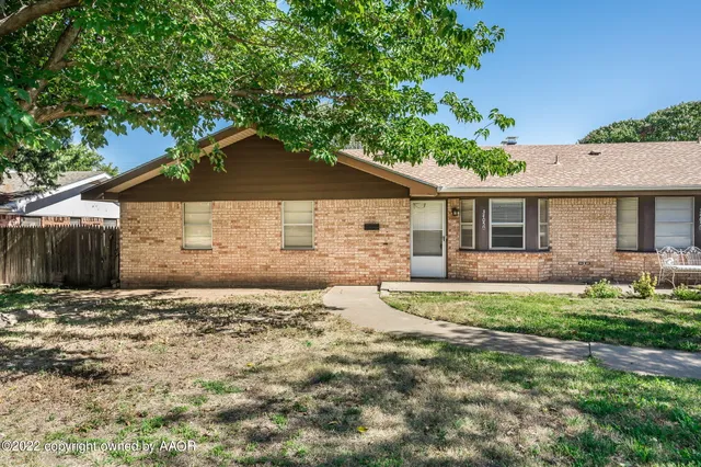 a house with a tree in front of it