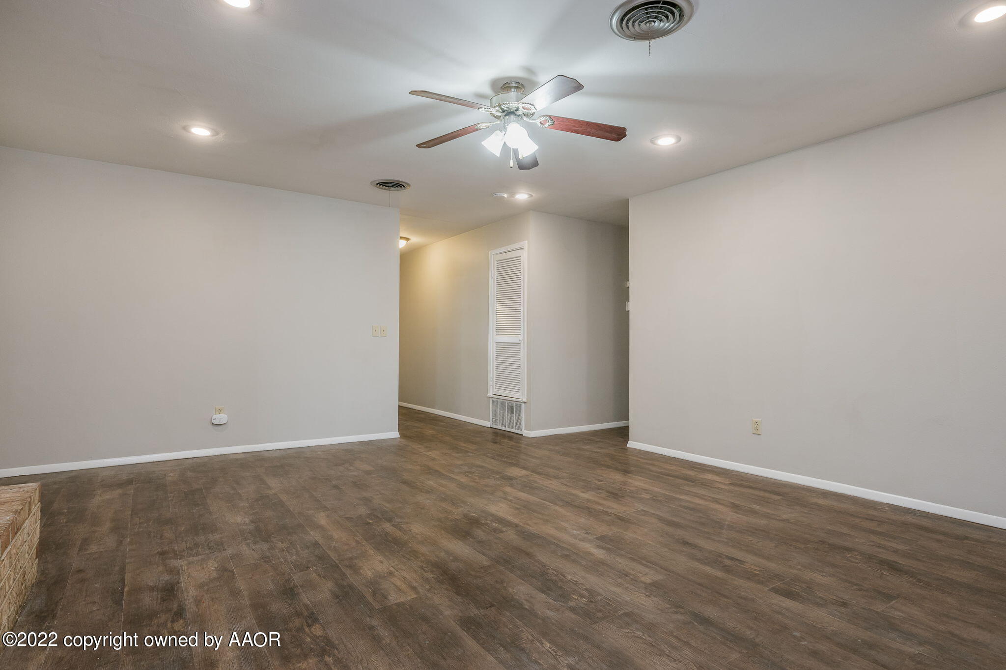 3405 Thurman Street Amarillo, TX 79109 - Photo 5 of 19 a view of an empty room with a ceiling fan and window