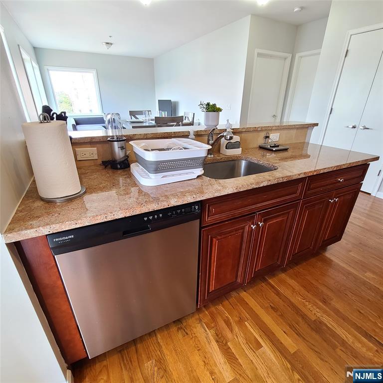 182 Anderson Avenue, Unit 3A Fairview, NJ 07022 - Photo 11 of 19 a living room with granite countertop furniture and a wooden floor