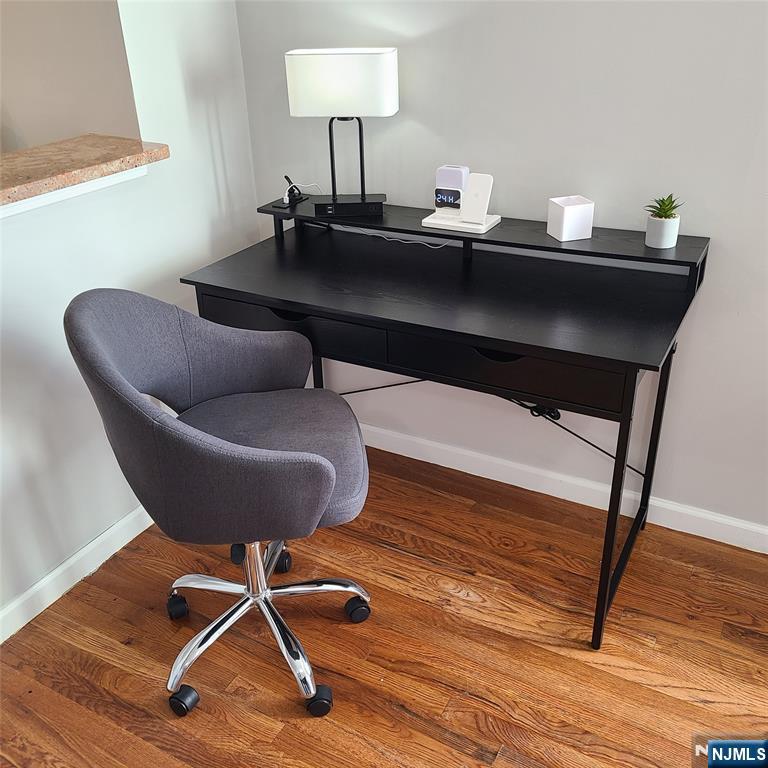 182 Anderson Avenue, Unit 3A Fairview, NJ 07022 - Photo 13 of 19 a living room with a table chairs and wooden floor