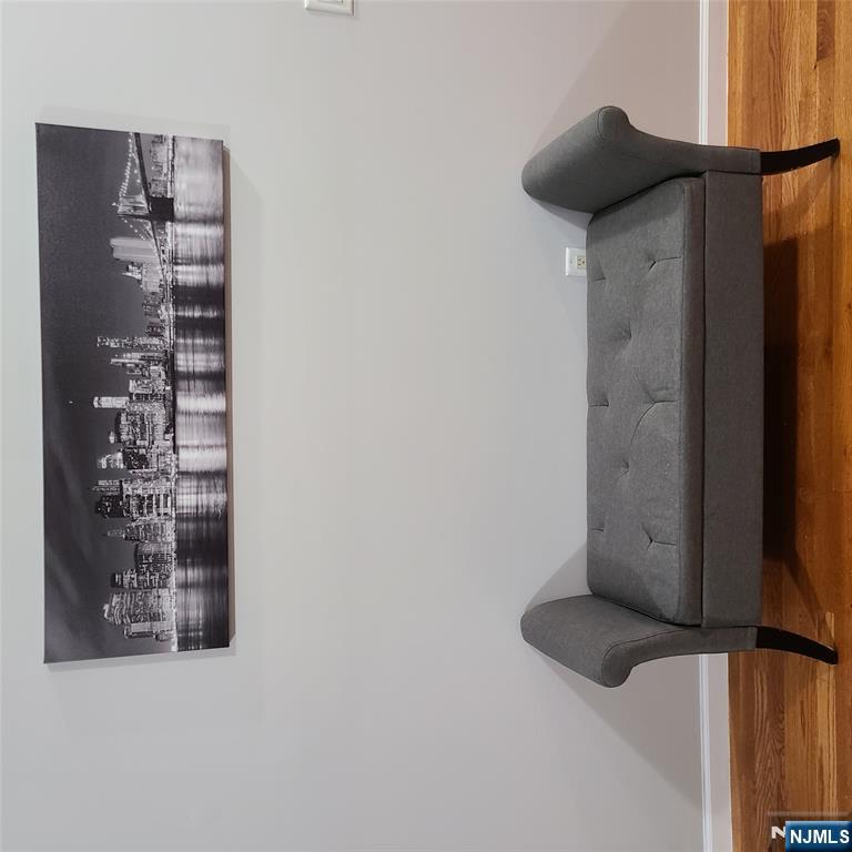 182 Anderson Avenue, Unit 3A Fairview, NJ 07022 - Photo 19 of 19 a view of wooden floor and chair in a room