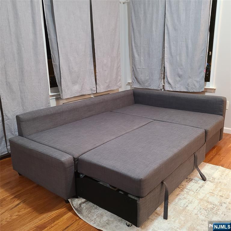 182 Anderson Avenue, Unit 3A Fairview, NJ 07022 - Photo 3 of 19 a living room with a couch and a window