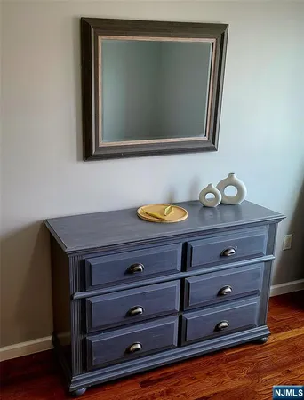 a view of room with wooden floor