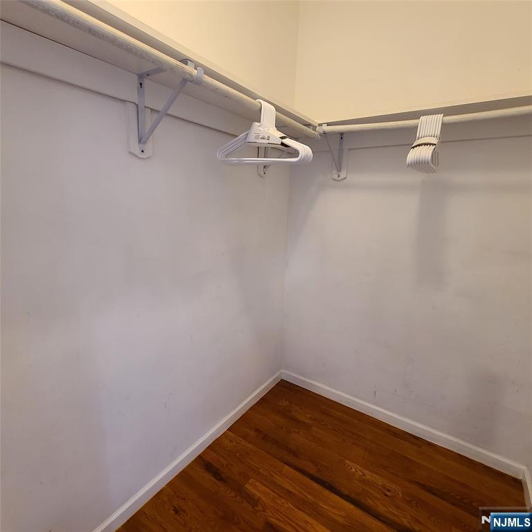 182 Anderson Avenue, Unit 3A Fairview, NJ 07022 - Photo 8 of 19 a view of a room with racks on the wall