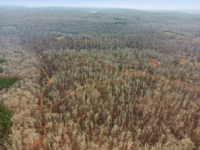 a view of a lake with a yard
